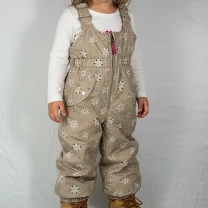 Obermyer Girls Snoveralls Tan with Multi Colored Snowflakes Snow Bibs | I-Grow